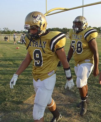 Image: Hunter Merimon(9) and Darol Mayberry(58) prepare for the Panthers with one last break before taking the field to start the 2013 campaign.