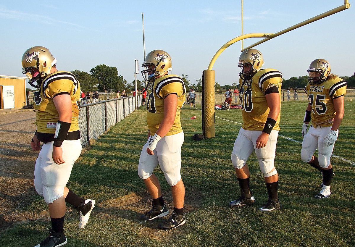 Image: John Byers(56), Zain Byers(50), Kevin Roldan(60) and Shad Newman(25) are Gladiators on and off the field and are ready to defend their town’s name, their teammates and their school’s honor.