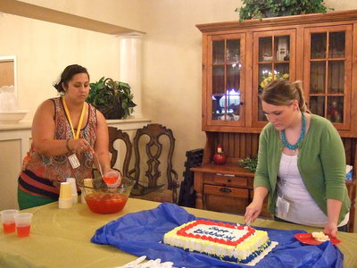 Image: Amanda Wilsford and Sarah Zambrano serve up the birthday goodies.