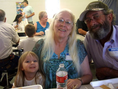 Image: Lyla Sutton (Pre-K) and grandparents Jan and Ron Jakubik having fun celebrating Grandparents Day.