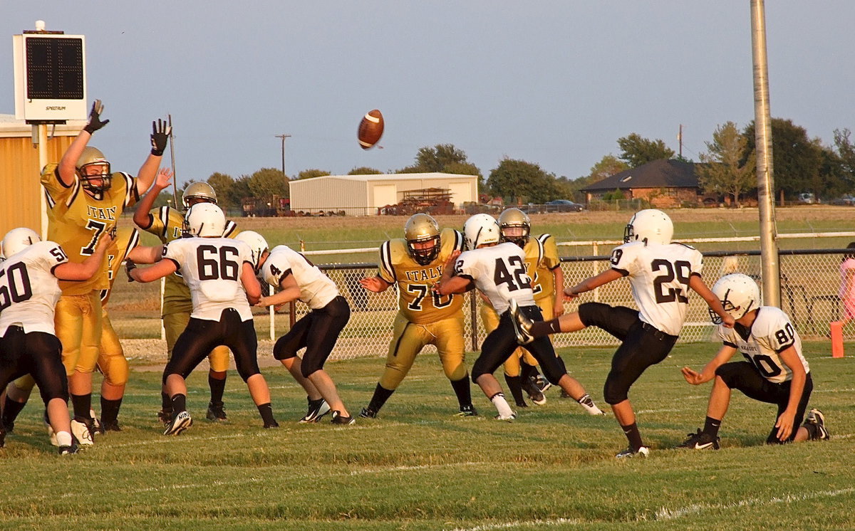 Image: Malakoff’s JV kicks a field goal as Aaron Pittmon(71), Kenneth Norwood, Jr.(63), and Adrian Acevedo(70) try for the block.