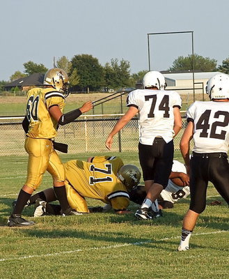 Image: Aaron Pittmon(71) explodes into the Tiger backfield and makes a tackle for a loss.