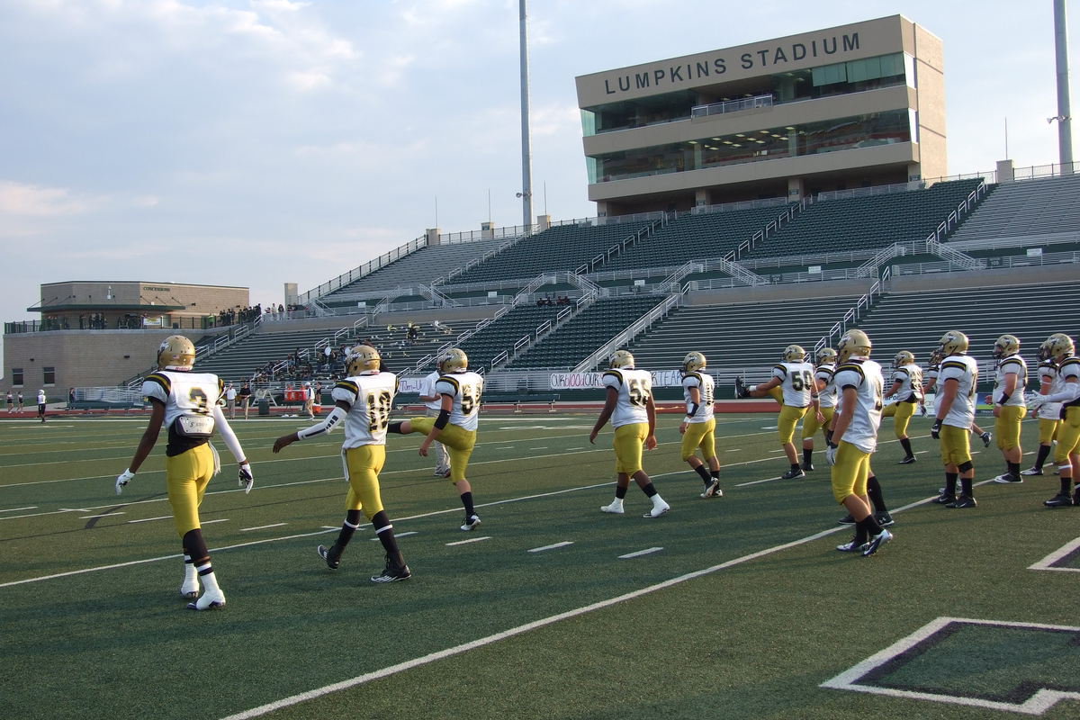 Image: The Gladiators stretch it out on the home field of the Waxahachie Indians.