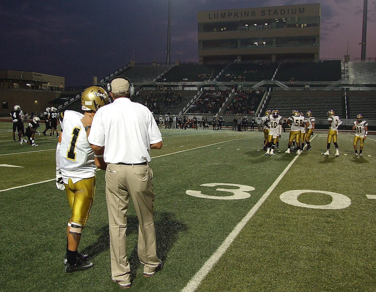 Image: Italy head football coach Charles Tindol sends a play in via Levi McBride(1).