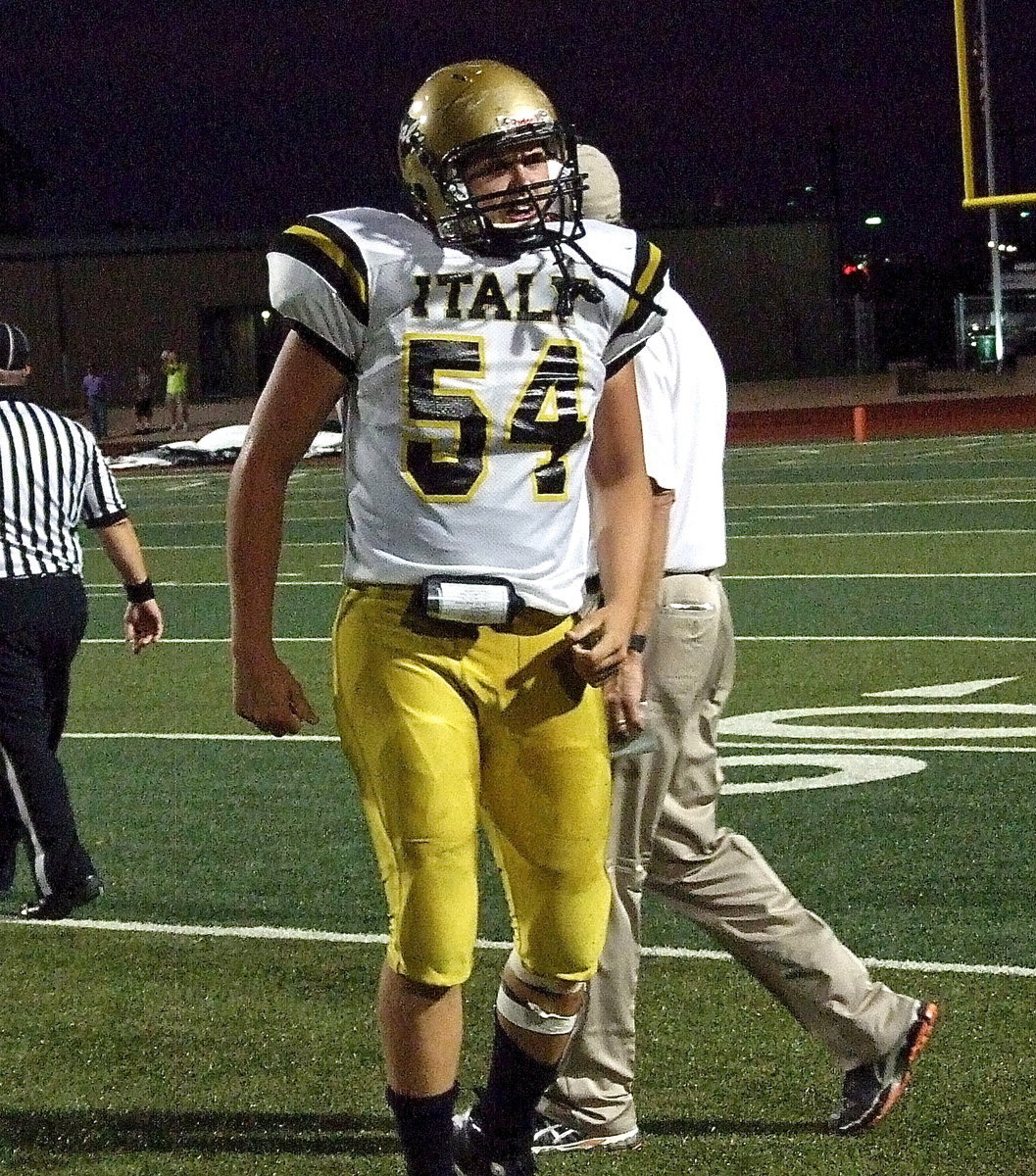 Image: Defensive end Bailey Walton(54) celebrates his big hit that caused the fumble.