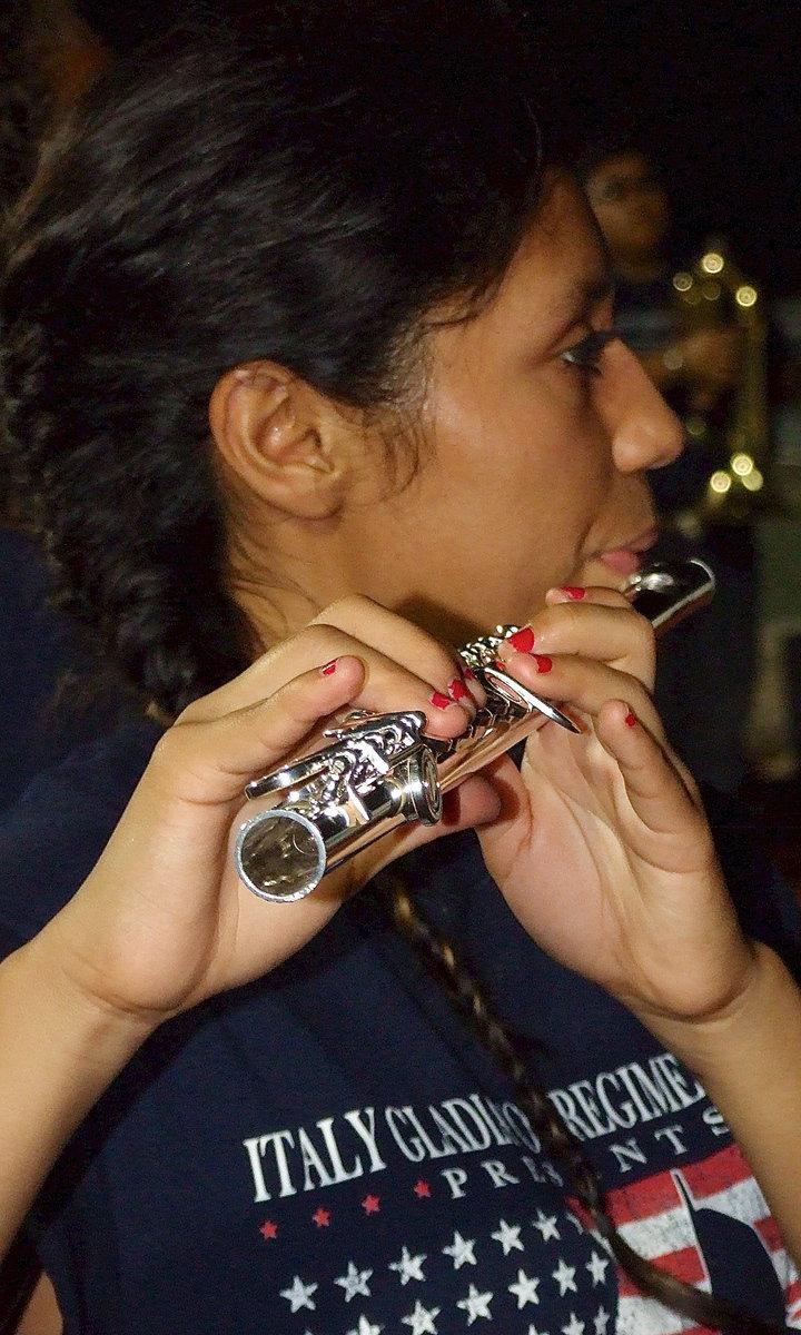 Image: Preparing for the halftime show is Gladiator Regiment Band member Julissa Hernandez.