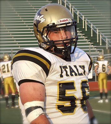 Image: Italy junior defensive tackle John Byers(56) has a determined look to begin the Classic. Byers would later recover a fumble for the Gladiators.