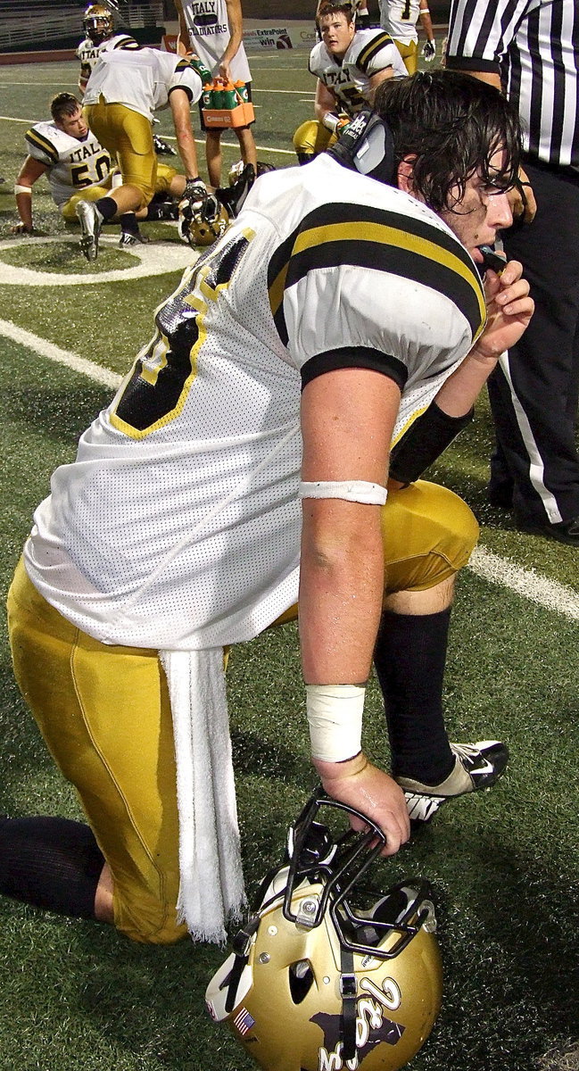 Image: Italy’s Kyle Fortenberry(66) pauses during an injury timeout.