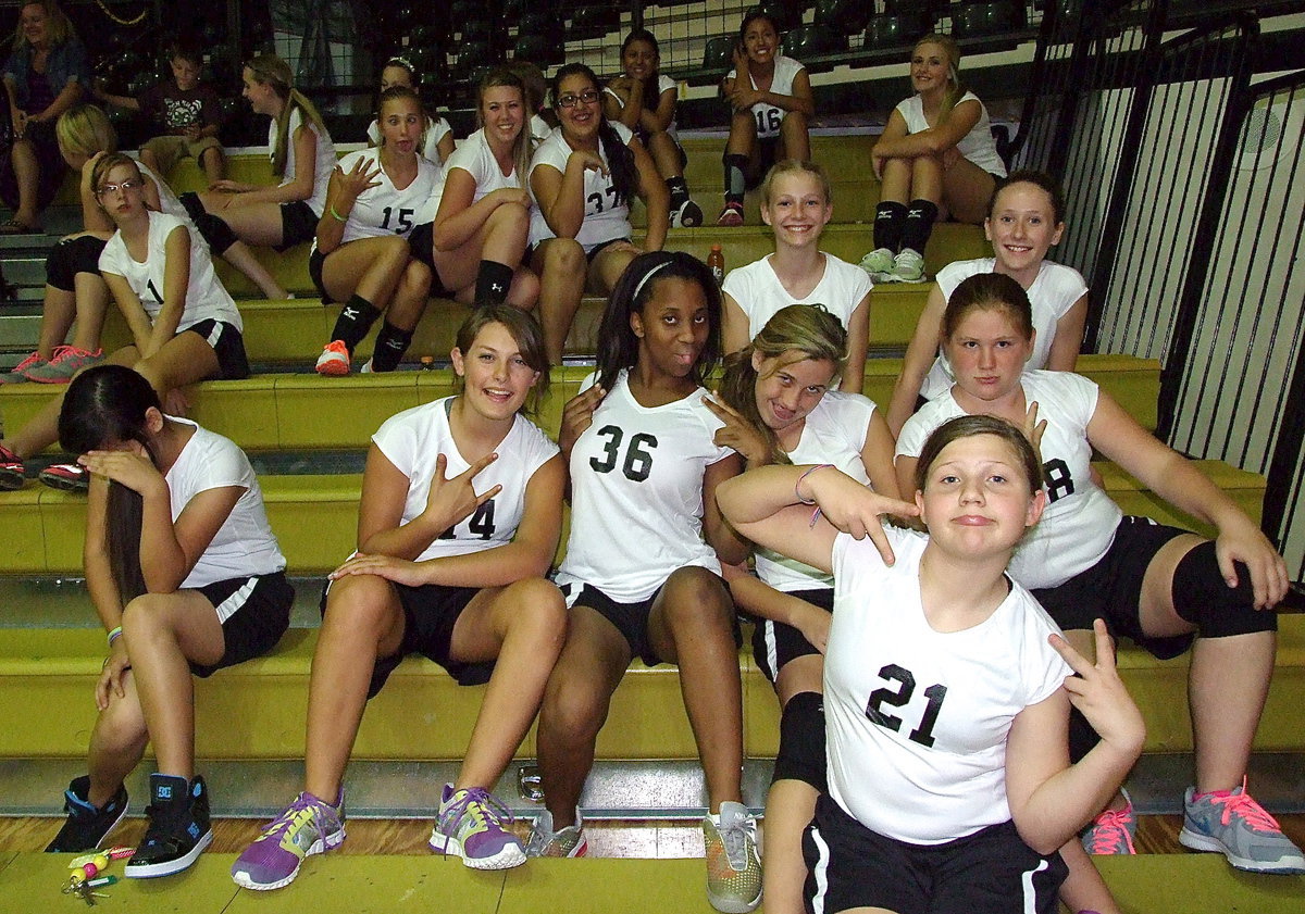 Image: Several members of the Italy Junior High volleyball teams keep the energy stirred up from the bleachers with squad spirit and plenty of personality as Italy welcomed Bynum to the coliseum for a triple-header.