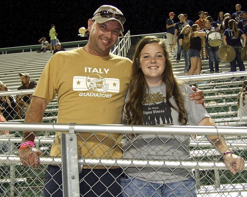 Image: Reagan Cockerham and her father Paul Cockerham are enjoying the Dale Hansen Football Classic while supporting the Gladiators.