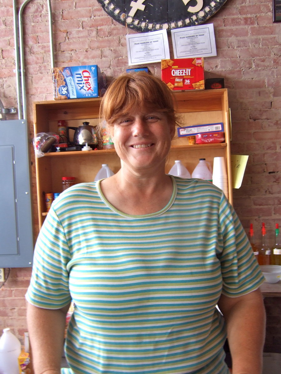 Image: Margaret Helms happy to serve Milford and surrounding towns with grocery items and snow cones!