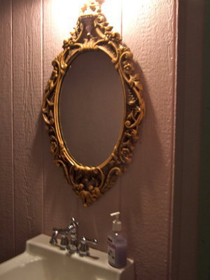 Image: Antique mirror makes this bathroom very inviting.