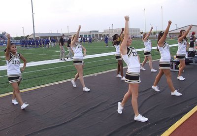 Image: Cheerleaders Jessica Garcia, Kelsey Nelson, K’Breona Davis, Taylor Turner, Britney Chambers, Ashlyn Jacinto and Kristian Weeks ready the crowd during the pre-game.