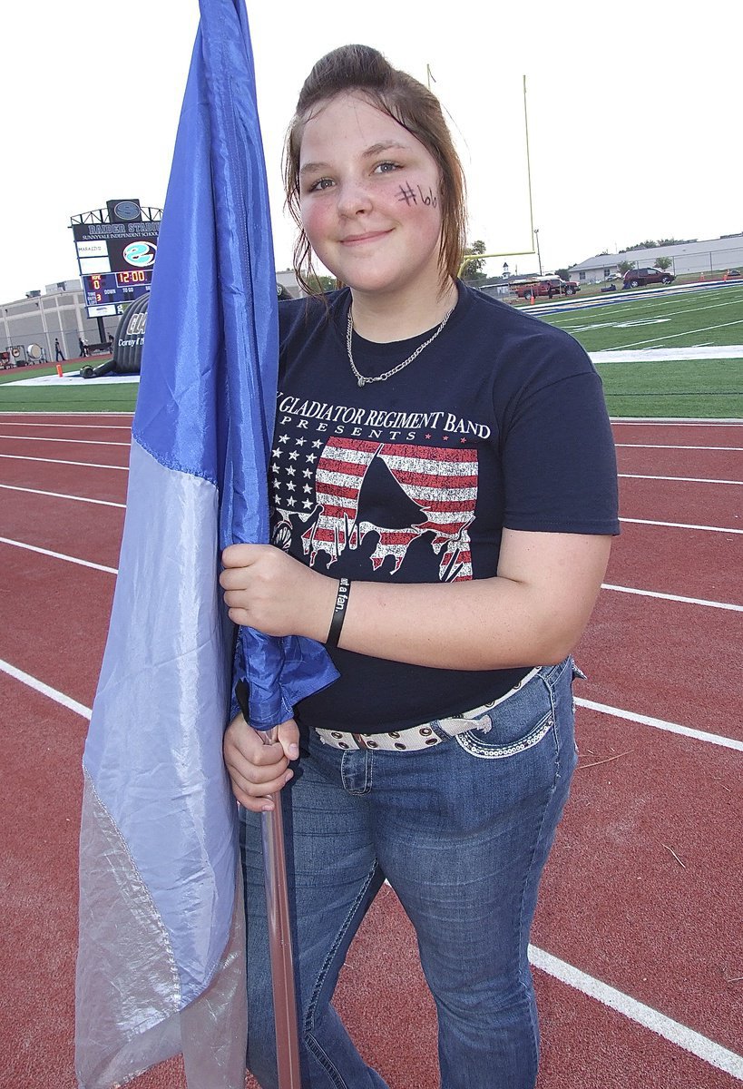 Image: Color Guard member Sarrah Burrows knows the routine.