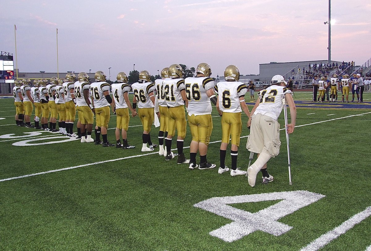 Image: The Gladiators unite during the coin toss.