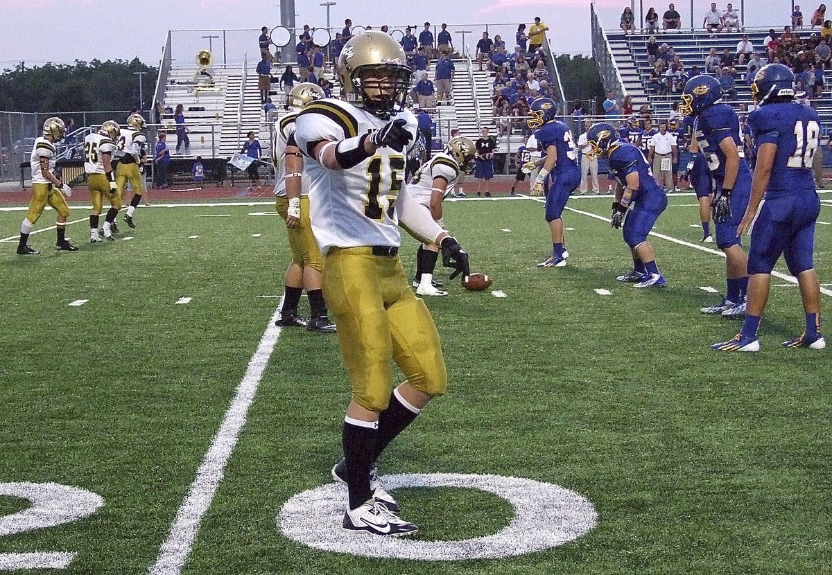 Image: Receiver Cody Boyd(15) checks with the line judge before the snap.