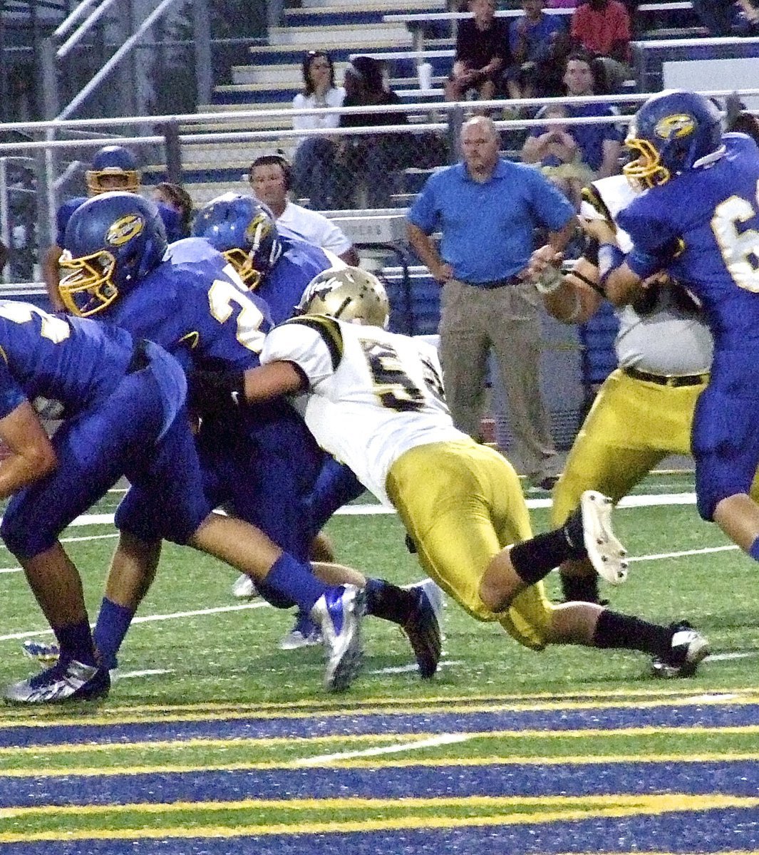 Image: Senior defensive end Bailey Walton(54) locates a Raider ball carrier.