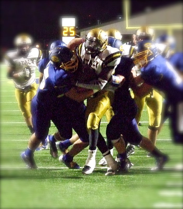 Image: TaMarcus Sheppard(11) drags Sunnyvale tacklers on his way to an 111 yard rushing night.