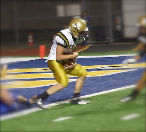 Image: Italy cornerback Justin Wood(4) intercepts a pass at the goal line and returns it 50-yards.