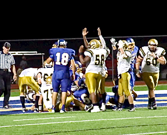 Image: Darol Mayberry(58), Hunter Merimon(9) and TaMarcus Sheppard(10) celebrate a touchdown by teammate Tyler Anderson(11).