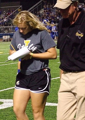 Image: Stat Squad girl Jaclynn Lewis, a junior, stays close to the coaches so she doesn’t miss any details.