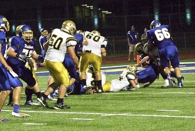 Image: Bailey Walton(54) wraps a Raider around the haunches for one of his 4 tackles.