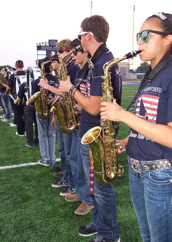 Image: The Gladiator Regiment Band forms the spirit line to welcome the football players onto the field.