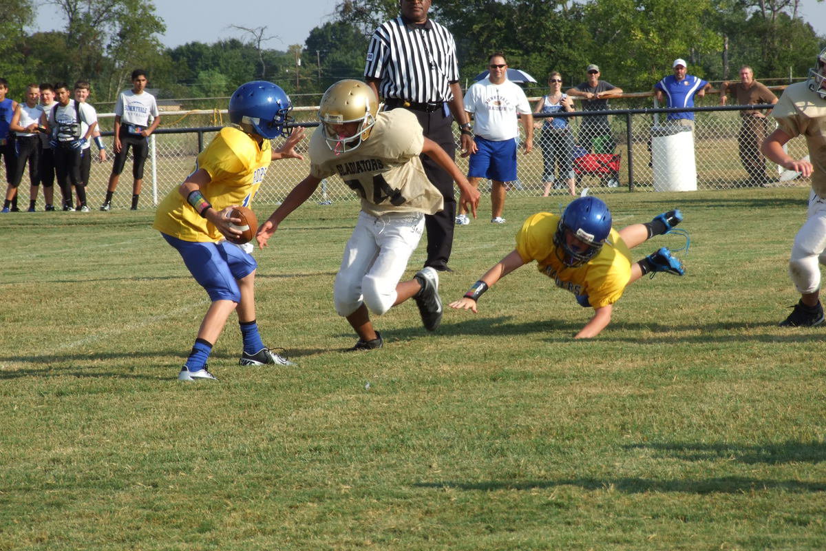 Image: Jacob Wiser(74) sheds a blocker and destroys the Raider quarterback.