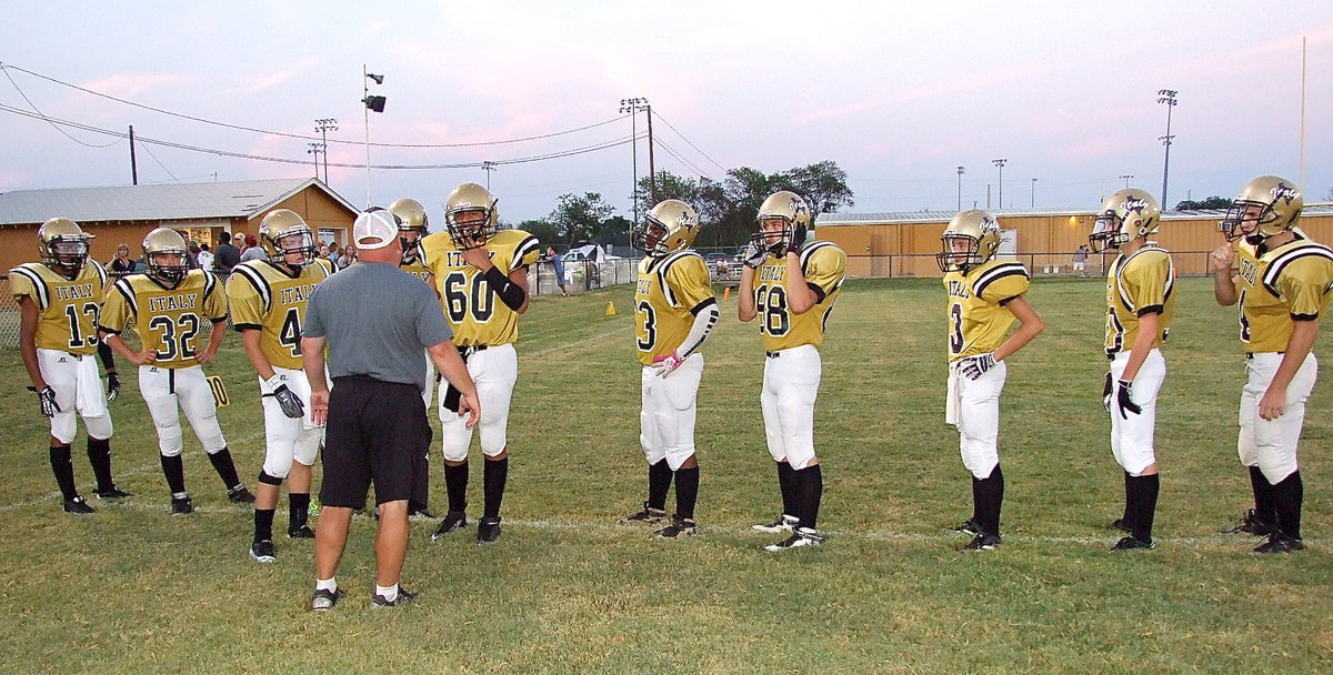 Image: Coach Wayne Rowe preps his kick team.