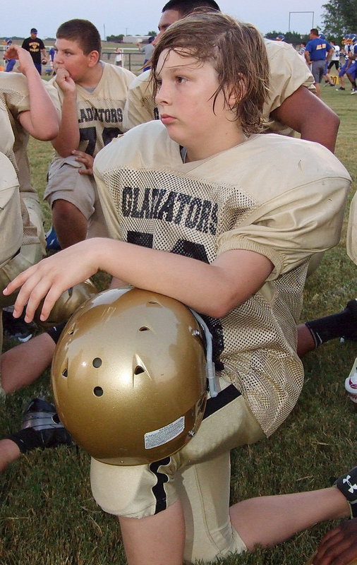 Image: Stockard Smithwick listens to his coaches after the game.