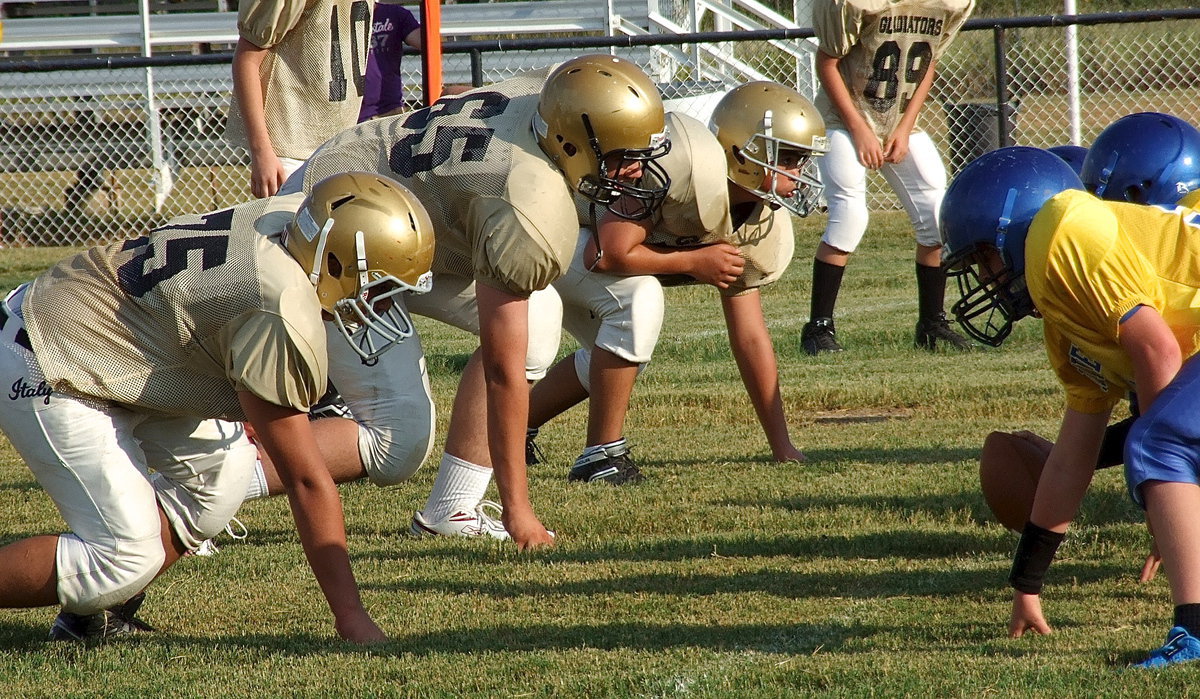 Image: Wesley Helms(65) leads the Italy 7th grade defense from his noseguard position.