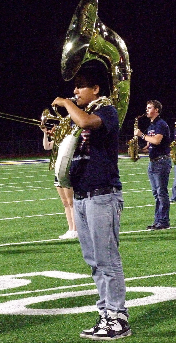 Image: David De La Hoya on tuba and JoeMack Pitts on sax during the Gladiator Regiment Band’s halftime performance.