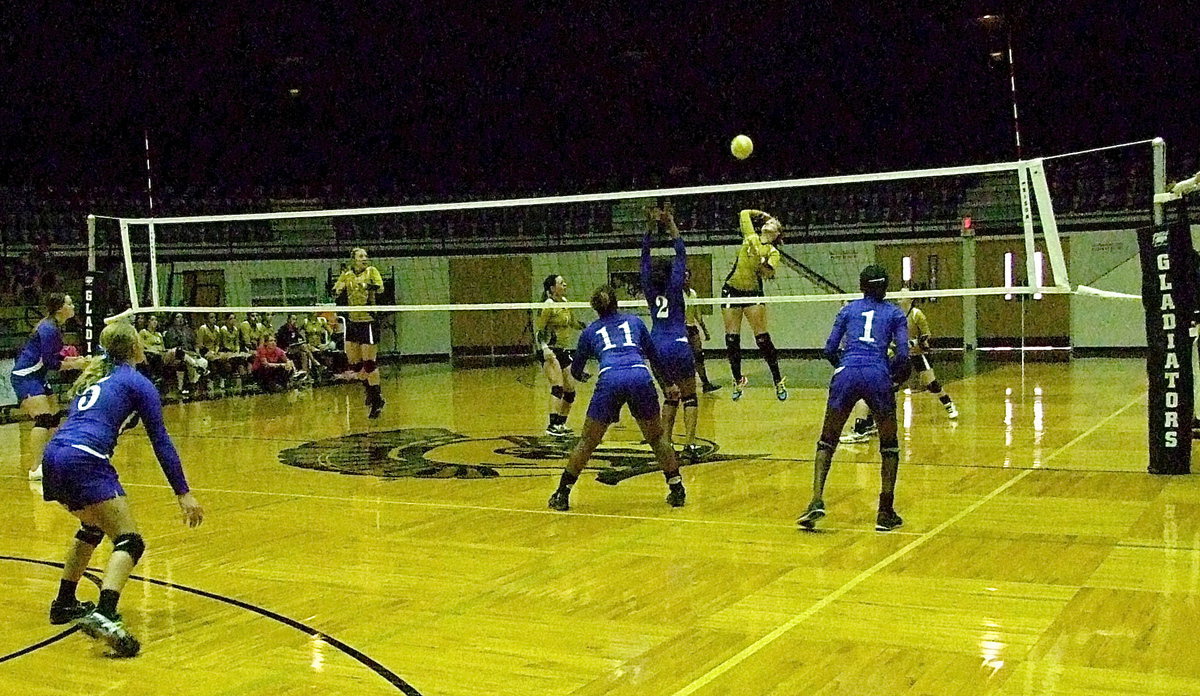 Image: Lady Gladiator Madison Washington(10) rises to the occasion against Milford at home inside the Italy Coliseum dome.