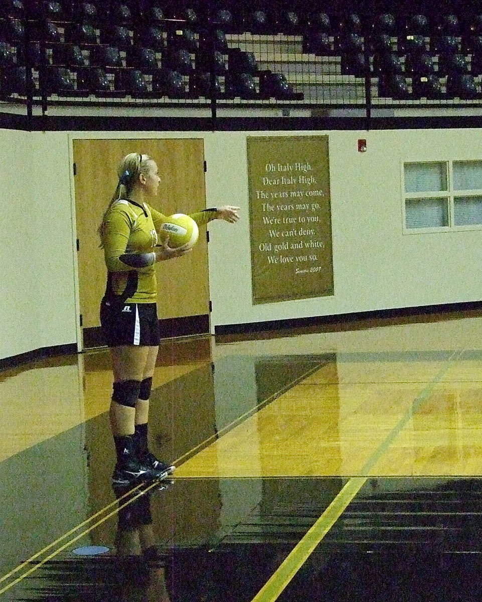 Image: Lady Gladiator Jaclynn Lewis(13) prepares to serve.