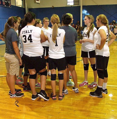 Image: Coaches Tina Richards and Holly Bradley huddle with their girls.