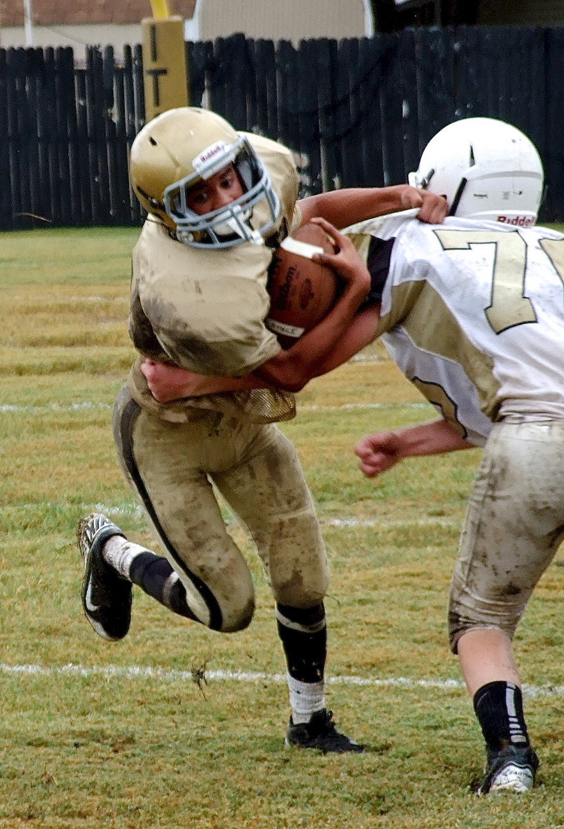 Image: Italy quarterback Tylan Wallace(10) breaks a tackle and then breaks upfield.