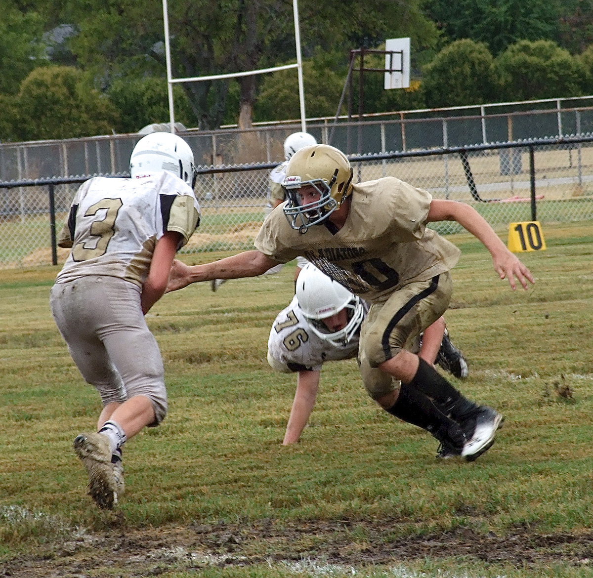 Image: Defensive end Clay Riddle(60) trucks into Hubbard’s backfield to record a sack.