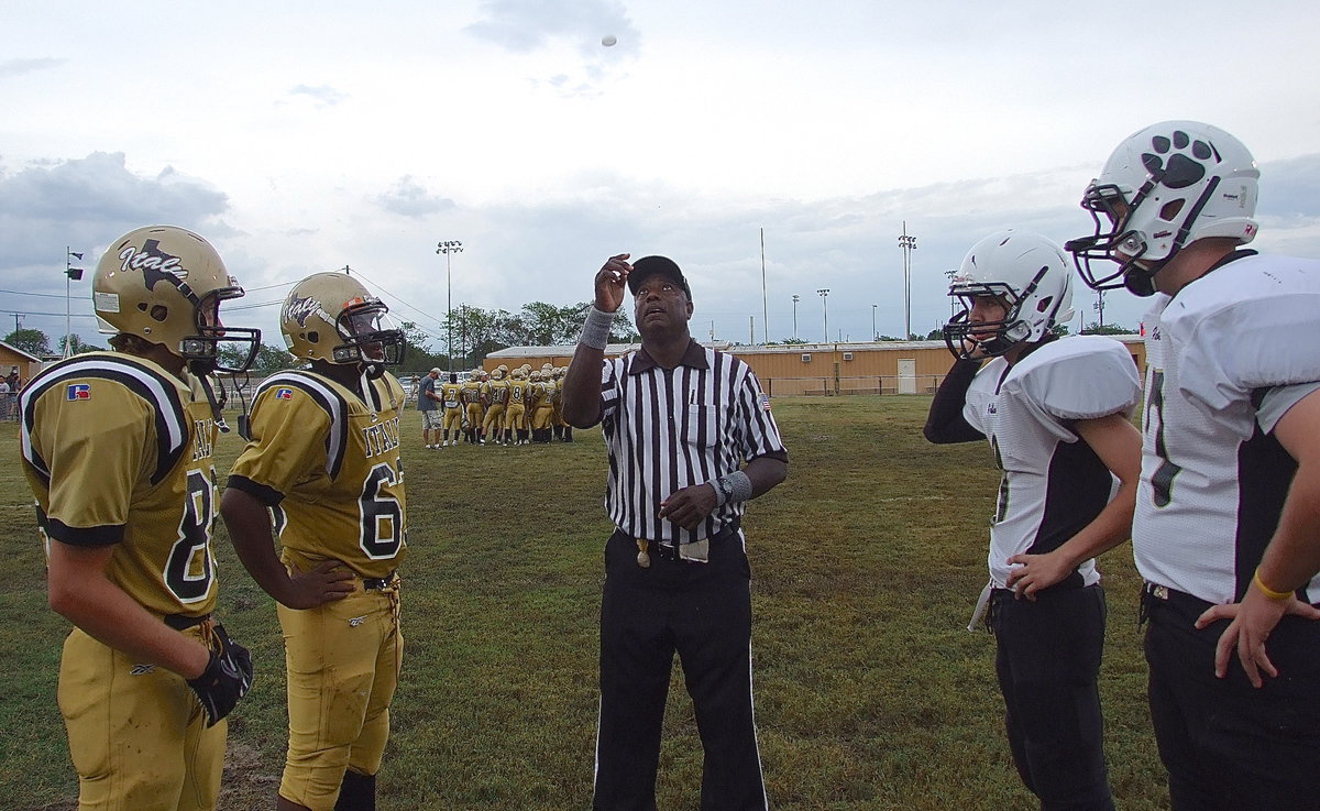 Image: JV captains for the Gladiators are Kenneth Norwood, Jr., and Kyle Machovich(88) as they and the Hubbard captains await the result of the coin flip.