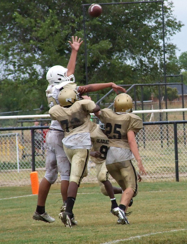 Image: Anthony Lusk(72), Kyle Tindol(25) and Chasston Wilson(9) foil Hubbard’s 2-point conversion attempt after the Jags tied the game 6-6.