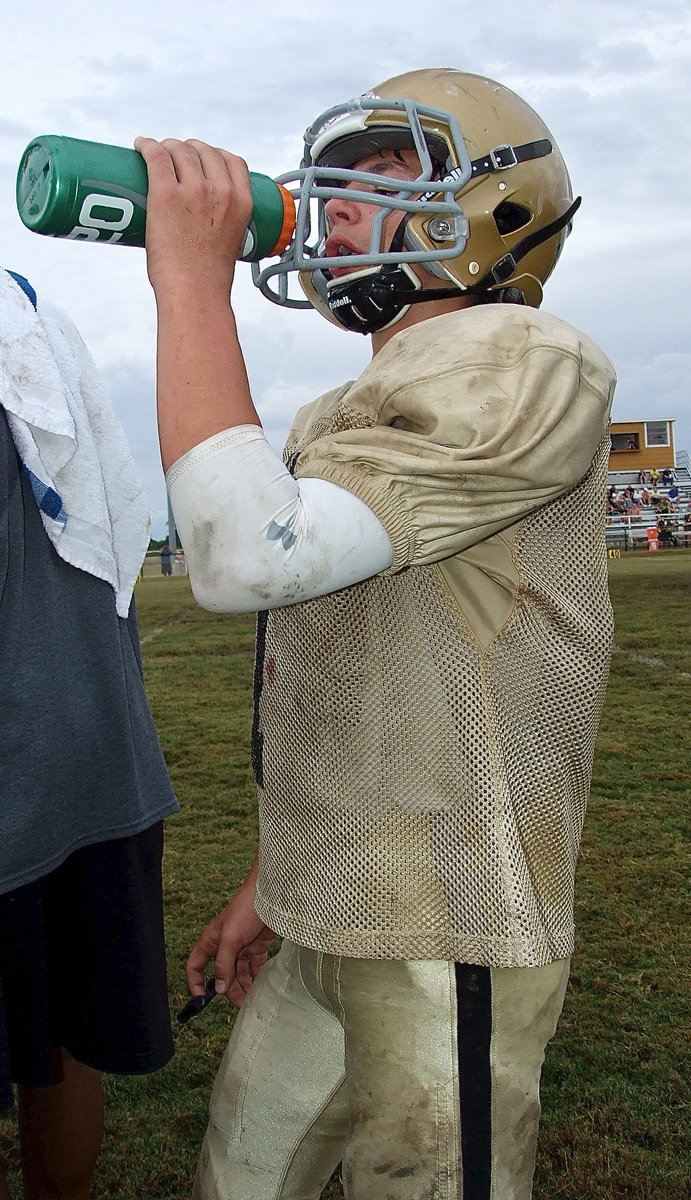 Image: Gary Escamilla(7) gets hydrated.