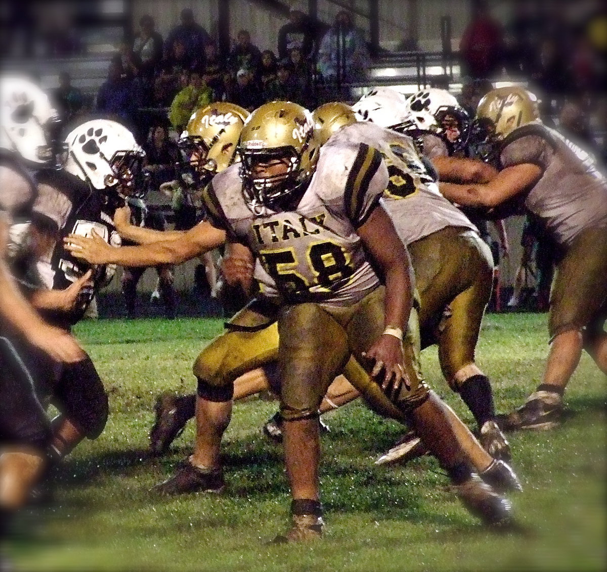 Image: Left tackle Darol Mayberry(58) and left guard Cody Medrano(75) try to help get Italy’s passing game going.