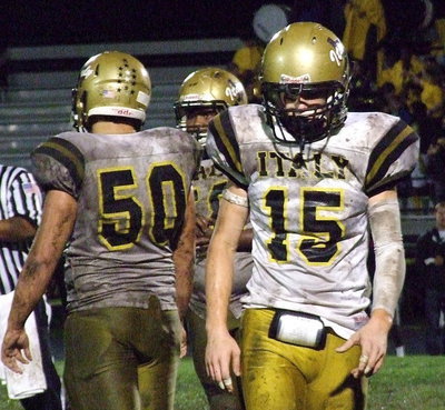 Image: Cody Boyd(15), Zain Byers(50) and Darol Mayberry(58) are covered with “Mud Bowl.”