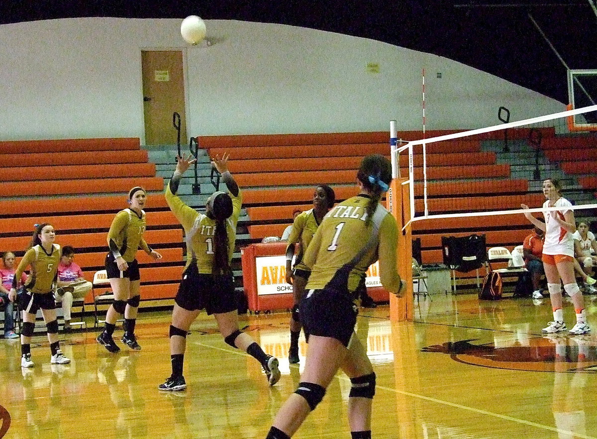 Image: Italy’s Monserrat Figueroa(15) sets the ball up for her teammates.