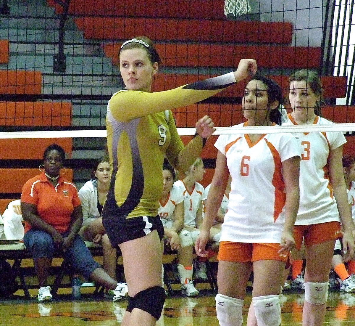 Image: Lillie Perry(9) prepares for the upcoming serve.