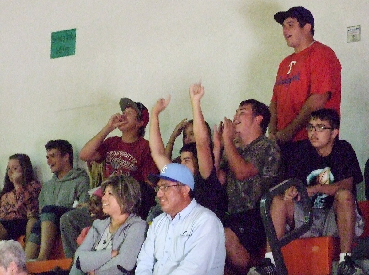 Image: Several of Taylor Turner’s senior classmates cheer her and her teammates forward against Avalon.