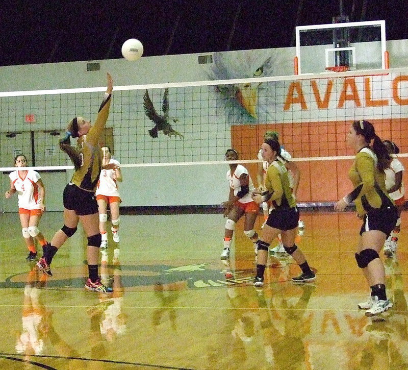 Image: Madison Washington(10) taps the ball to her teammate Paige Westbrook(11).