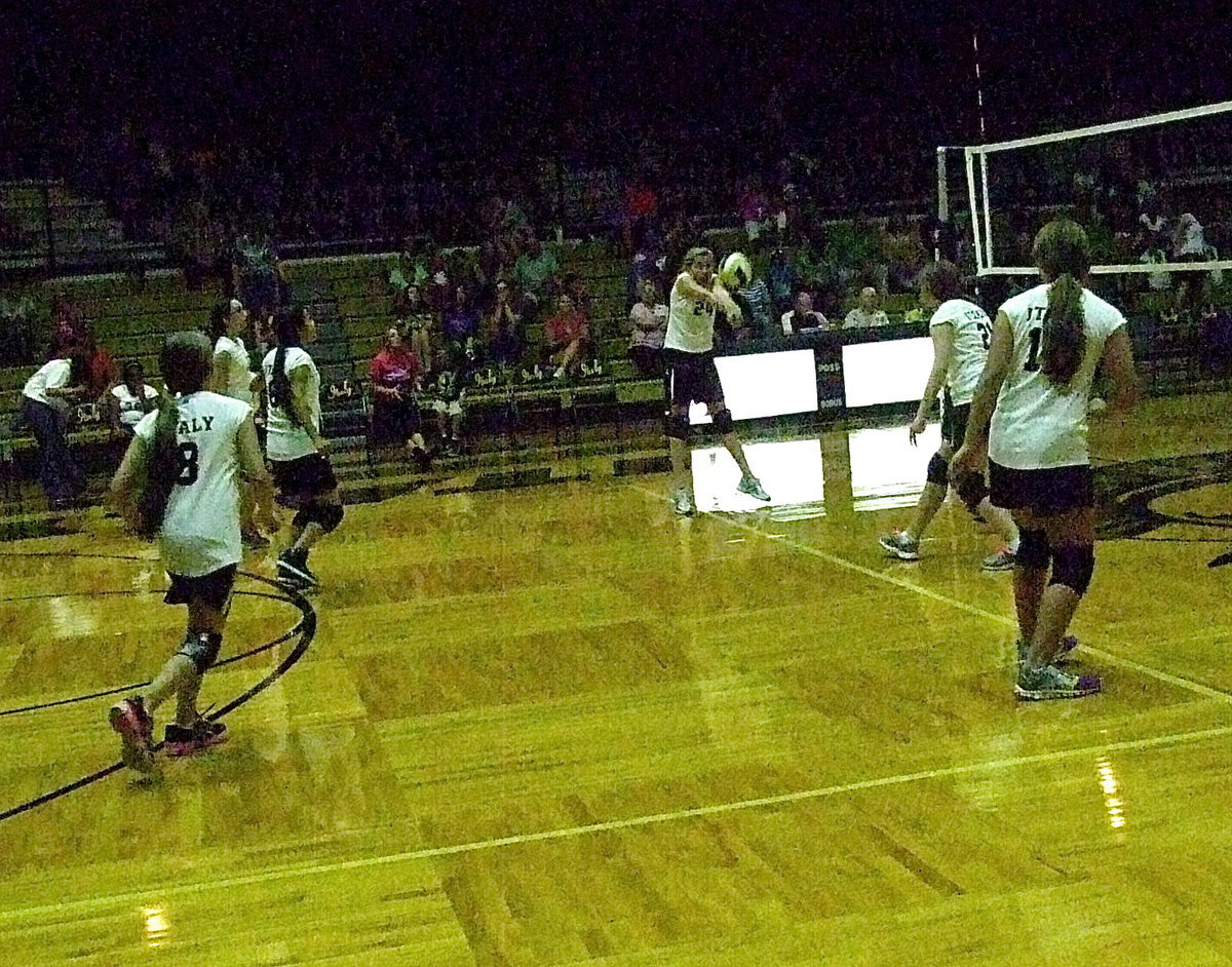 Image: On the far side of the court, Hannah Haight(24) bumps the ball back to Kopperl.