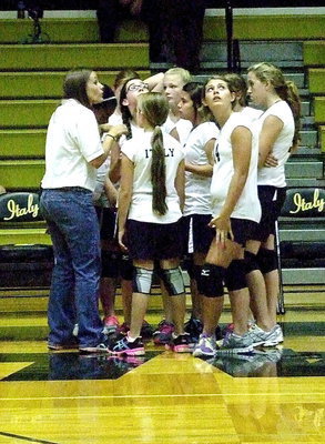 Image: Coach April Gage talks to her gals during a timeout.