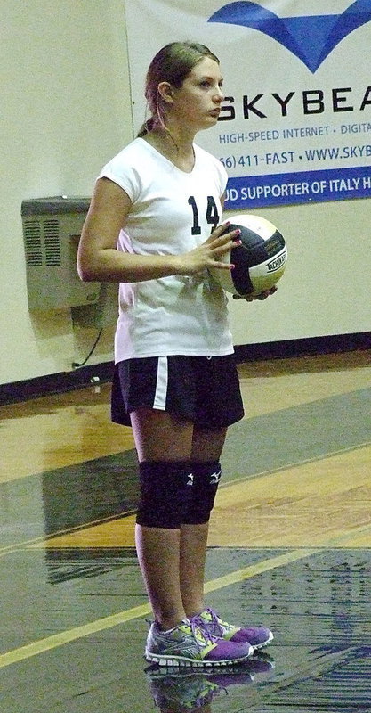 Image: Cassidy Gage(14) is ready to serve.