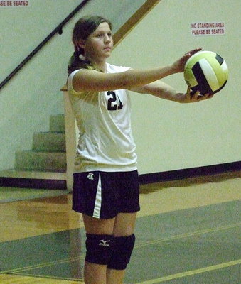 Image: Tatum Adams(21) is determined to serve an ace.